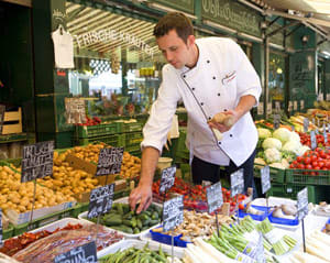 Selecting fresh produce - Courtesy of Uniworld Boutique River Cruise Collection